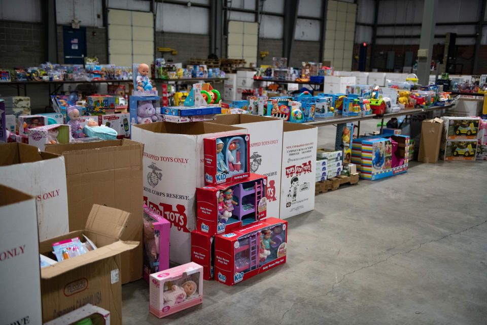 Toys for Tots volunteers arranged hundreds of toys in a warehouse in Leetsdale.