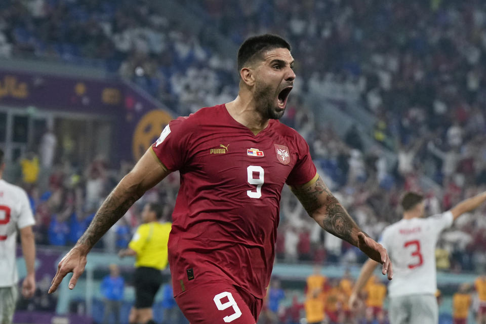 Serbia's Aleksandar Mitrovic celebrates after scoring his side's first goal during the World Cup group G soccer match between Serbia and Switzerland, in Doha, Qatar, Qatar, Friday Dec. 2, 2022. (AP Photo/Ricardo Mazalan)