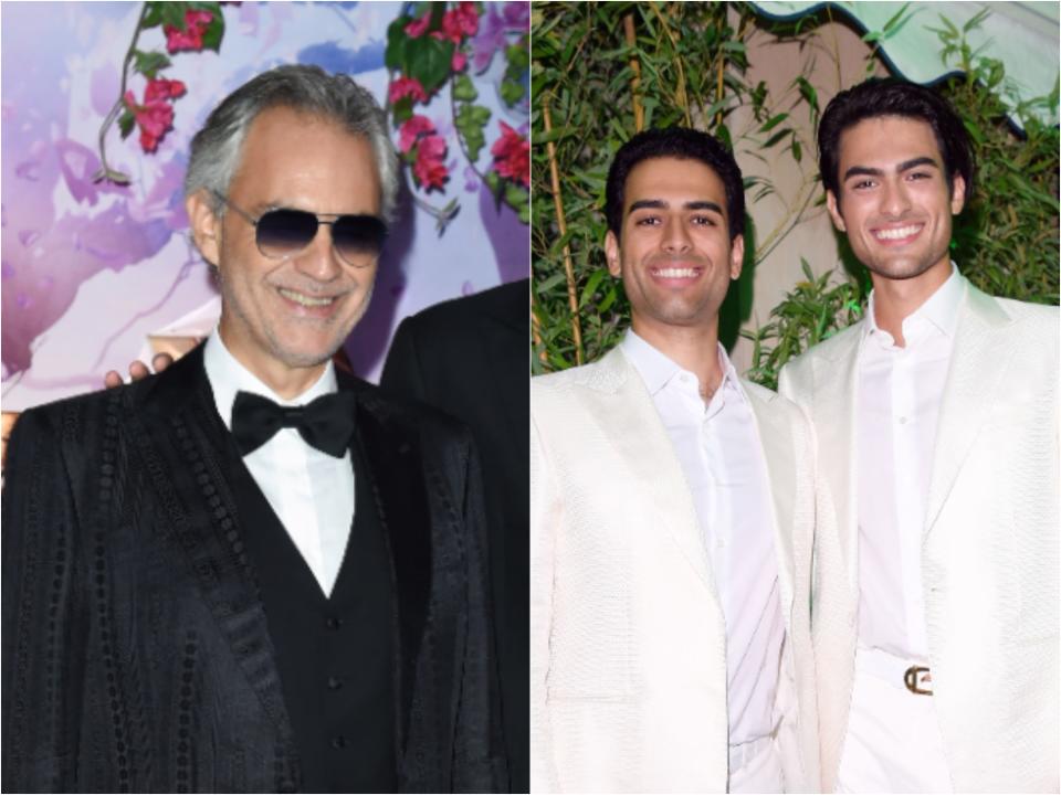 Andrea smiling with sunglasses and grey hair and Amos and Matteo smiling with black hair and matching white suits.