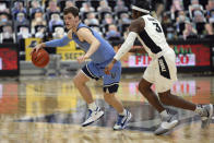 Providence's David Duke (3) defends Villanova's Chris Arcidiacono (4) during the second half of an NCAA college basketball game in Providence, R.I., Saturday, March 6, 2021. (AP Photo/Stew Milne)