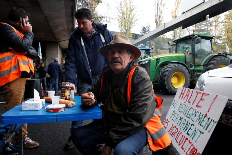 French farmers block the ring road with their tractors during a day of protest in Paris