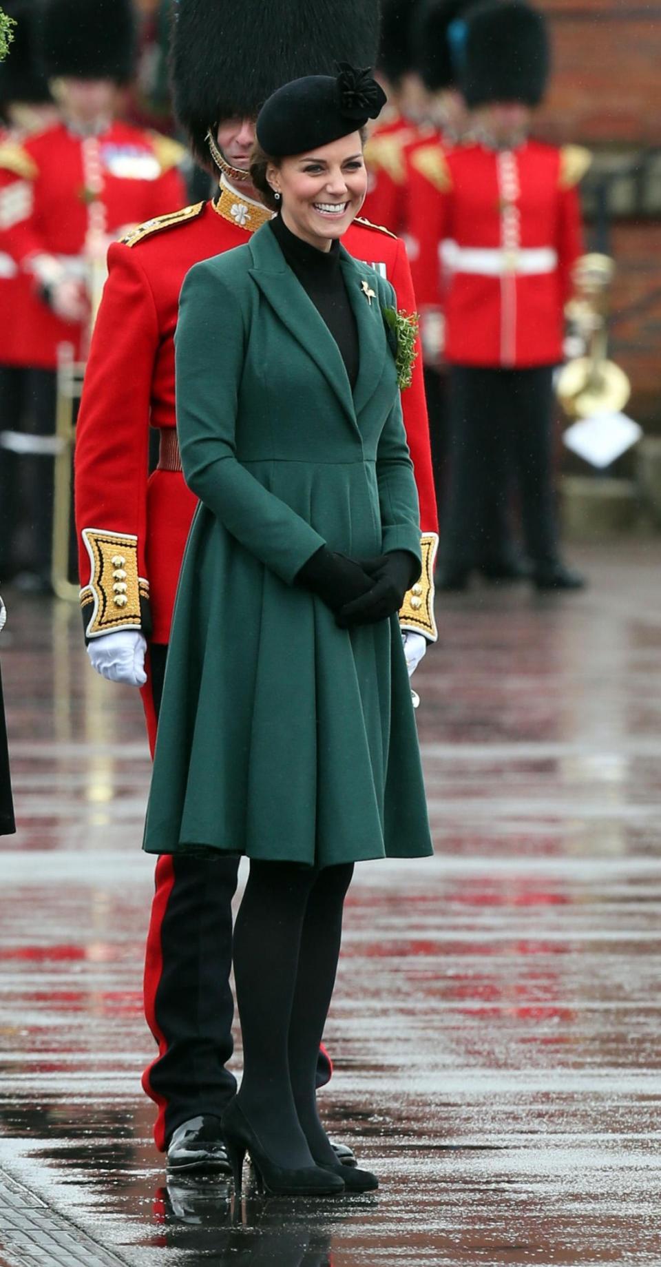 <p>In 2013, despite being pregnant with Prince George, Kate slipped into the same Emilia Wickstead coat she had worn the year before. She layered the look with a black high neck top, and accessorised with a black hat and Emmy London pumps. <em>[Photo: PA]</em> </p>