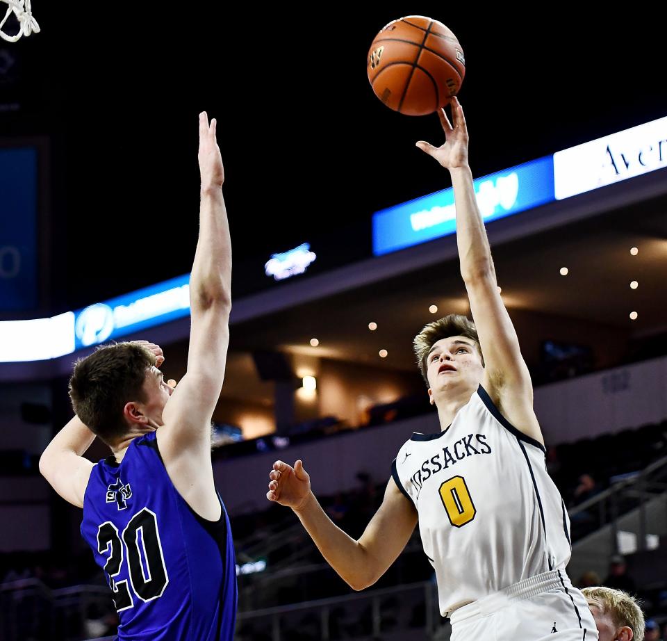 Sioux Valley's Patrick Carey shoots over St. Thomas More's Turner Thompson during the third-place game of the state Class A boys basketball tournament on Saturday, March 18, 2023 at the Denny Sanford PREMIER Center in Sioux Falls.