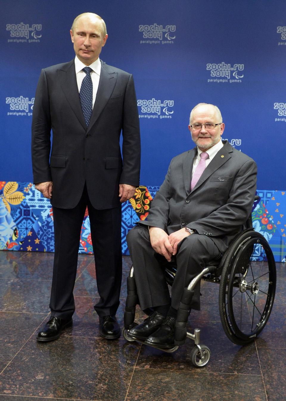 Russian President Vladimir Putin, left, and International Paralympic Committee President Philip Craven pose at a meeting with International Paralympic Committee board members and honorary council members before the opening ceremony of the 2014 Winter Paralympics in Sochi, Russia, Friday, March 7, 2014. (AP Photo/RIA-Novosti, Alexei Nikolsky, Presidential Press Service)