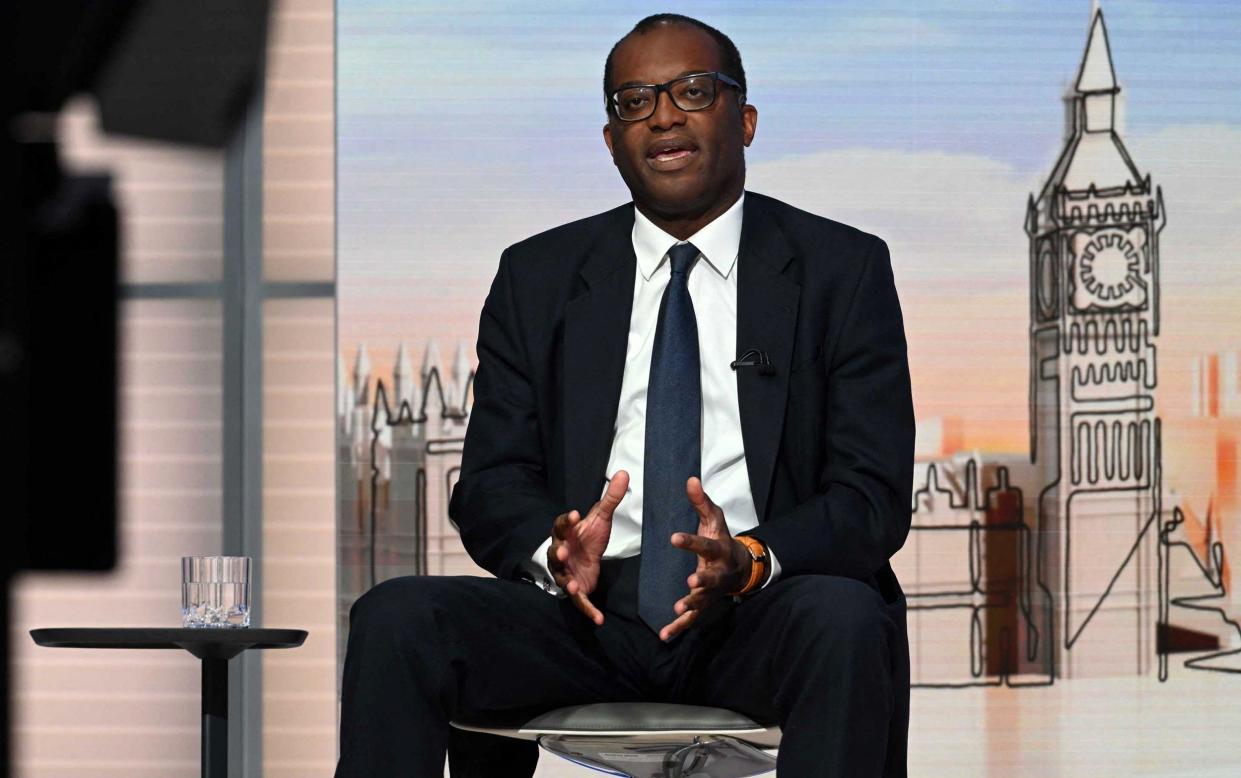 A handout picture released by the BBC, taken and received on September 25, 2022, shows Britain's Chancellor of the Exchequer Kwasi Kwarteng during an appearance on the BBC's 'Sunday Morning' political television show with journalist Laura Kuenssberg. - JEFF OVERS/ AFP