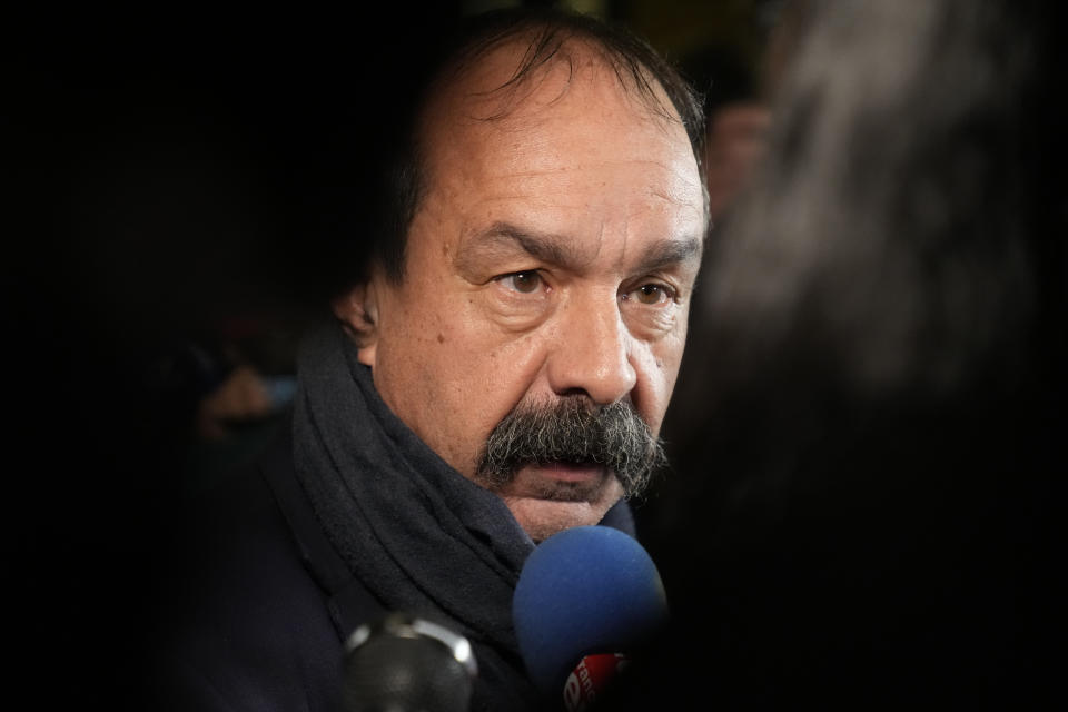 GGT leftist union leader Philippe Martinez, right, speaks to medias as he arrives for a meeting with unions leaders in Paris, Tuesday, Jan. 10, 2023. French Prime Minister Elisabeth Borne has unveiled a contentious pension overhaul aimed at raising the retirement age from 62 to 64 by 2030 that has prompted vigorous criticism and calls for protests from leftist opponents and worker unions. (AP Photo/Francois Mori)