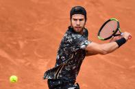 Russia's Karen Khachanov plays a backhand return to Germany's Cedrik-Marcel Stebe during their men's singles first round match on day three of The Roland Garros 2019 French Open tennis tournament in Paris on May 28, 2019. (Photo by Martin Bureau/AFP/Getty Images)