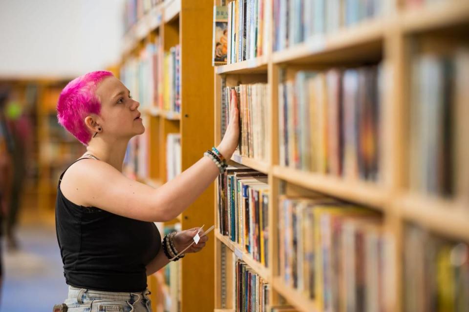 Charlie Stadem, 17, of Sacramento, works on categorizing and organizing at Beers Books during their soft opening Saturday, Aug. 26, 2023, at 712 R St. in Sacramento. She said she began working at the book store during a high school internship, and is now on staff at the decades-old business.