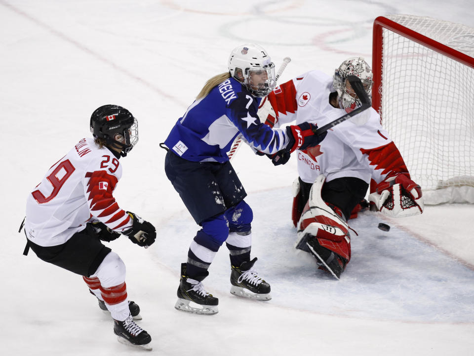 <p>Gigi Marvin (19), of the United States, collides between Renata Fast (14), of Canada, and Marie-Philip Poulin (29), of Canada, during the first period of the women’s gold medal hockey game at the 2018 Winter Olympics in Gangneung, South Korea, Thursday, Feb. 22, 2018. (AP Photo/Matt Slocum) </p>