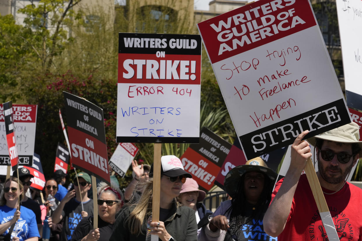 Members of the Writers Guild of America, WGA picket outside CBS Television City in the Fairfax District of Los Angeles Tuesday, May 2, 2023. The first Hollywood strike in 15 years began Tuesday as the economic pressures of the streaming era prompted unionized TV and film writers to picket for better pay outside major studios, a work stoppage that already is leading most late-night shows to air reruns. (AP Photo/Damian Dovarganes)