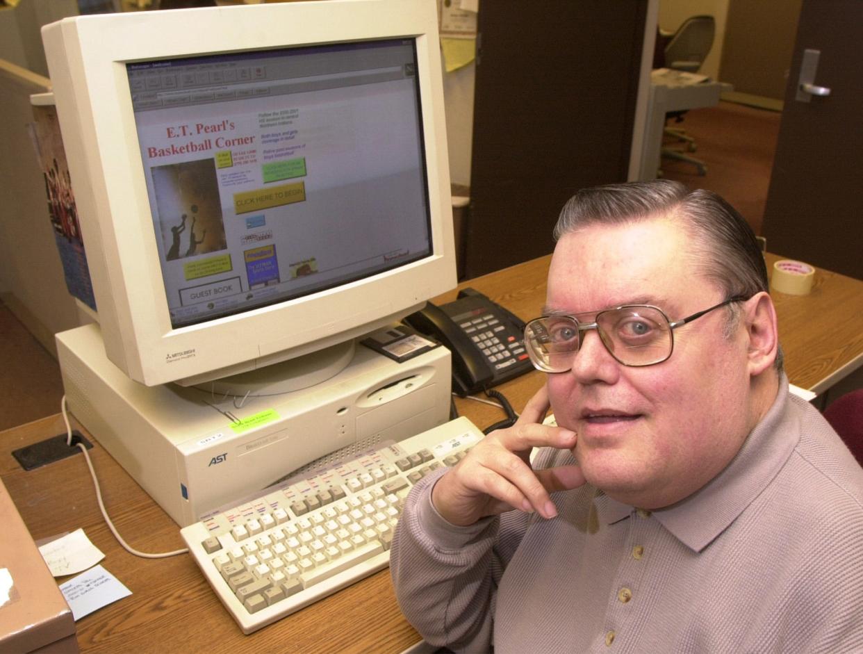 Earl Mishler, shown here in this 2001 file photo, constructed a comprehensive web site of area high school basketball results and histories.