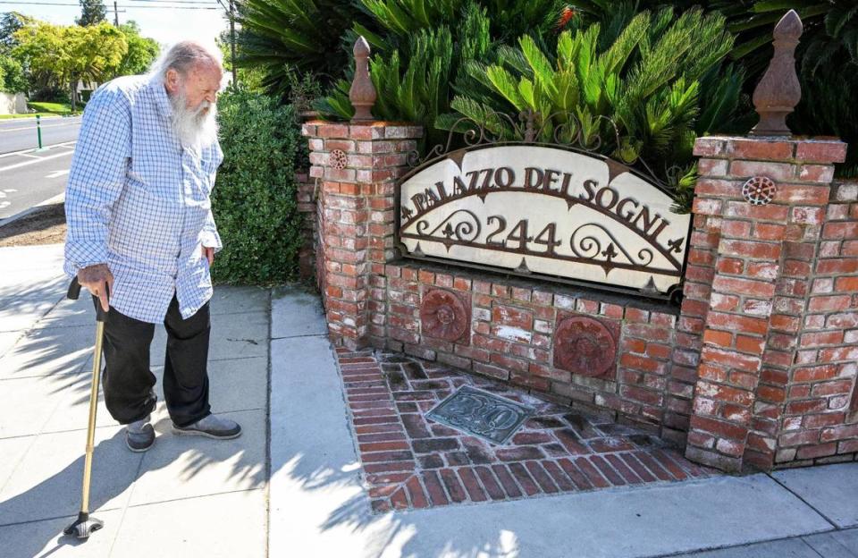 Jim Williams stops by the corner sign with the name “Palazzo Del Sogni” in front of his home in the Fresno High area. The name means Palace of Dreams in Italian. CRAIG KOHLRUSS/ckohlruss@fresnobee.com