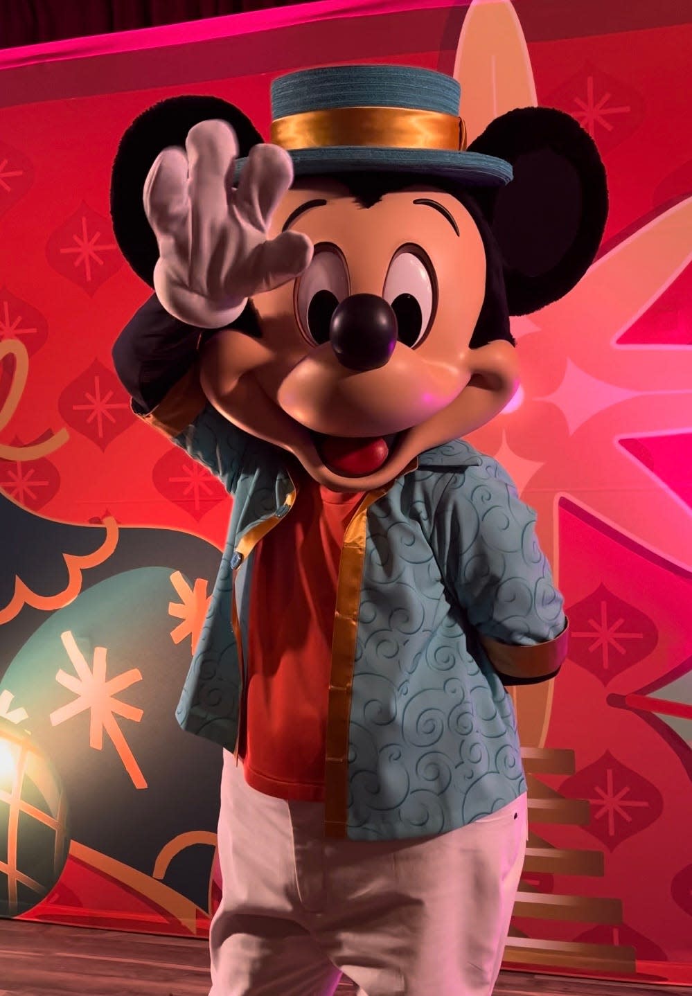 Mickey Mouse waves in his Jollywood Nights outfit.