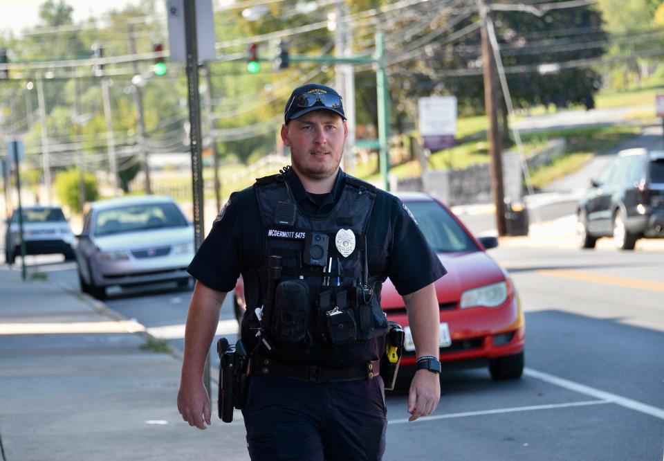 Hagerstown Police Community Resource Officer Mike McDermott walking along S. Cannon Ave. on Friday. McDermott's CRO assignment is the neighborhood from Locust Point to the Sheetz. He was hired in April 2020 and, after training, has been on the street since Feb. 2021.