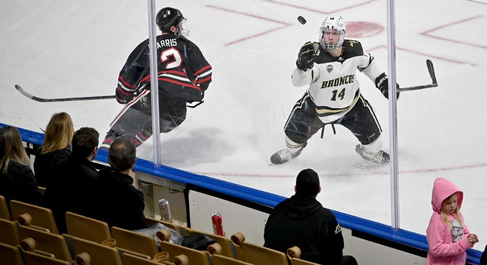 WORCESTER - Broncos' Jason Polin plucks a pass out of the air as Northeastern plays West Michigan during the 2022 NCAA Division 1 Men’s Ice Hockey Regionals at the DCU Center on Friday.