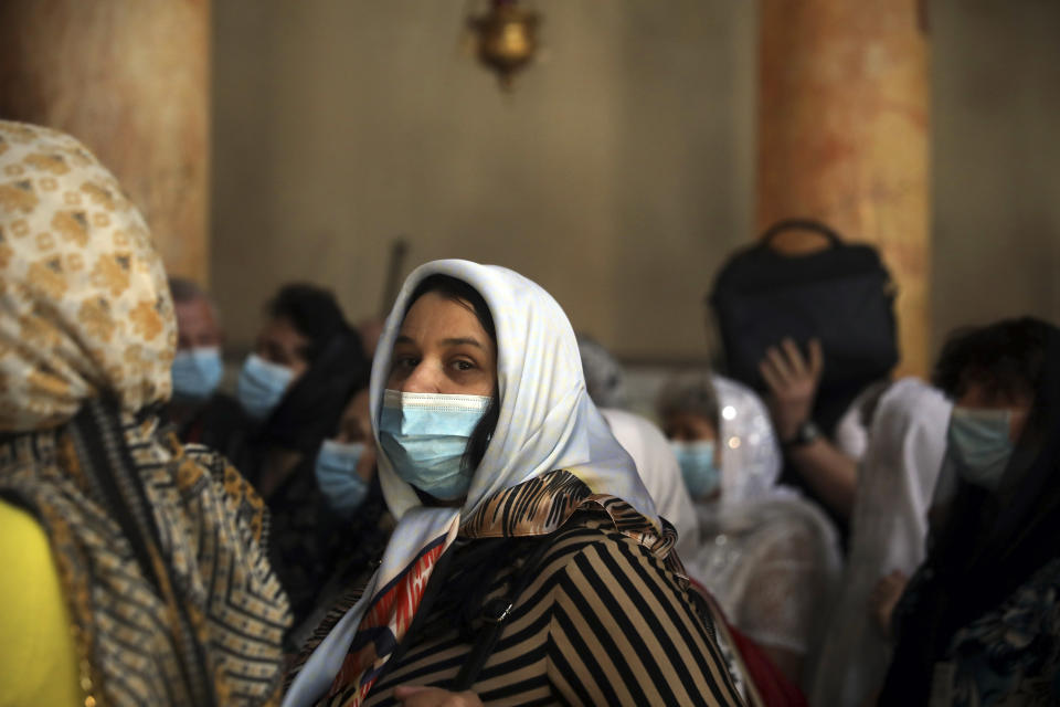 People visit the Church of the Nativity in Bethlehem, West Bank, Thursday, March 5, 2020. Palestinian authorities said the Church of the Nativity in Bethlehem, built atop the spot where Christians believe Jesus was born, will close indefinitely due to coronavirus concerns. (AP Photo/Mahmoud Illean)