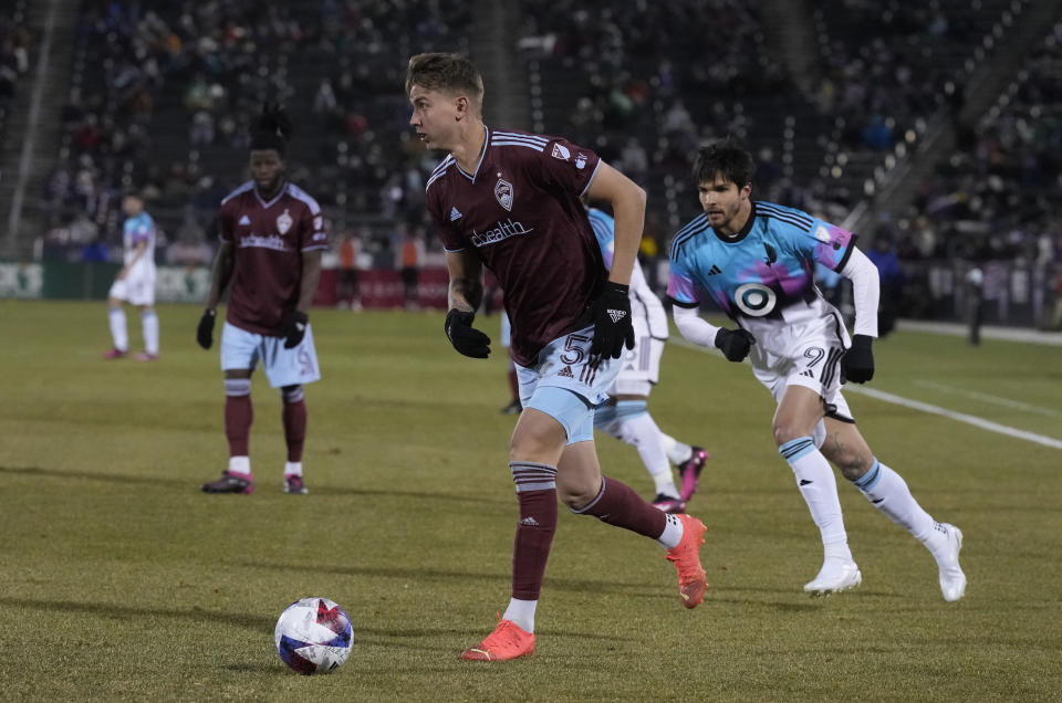 Colorado Rapids defender Andreas Maxso, front, pursues the ball next to Minnesota United forward Luis Amarilla during the second half of an MLS soccer match Saturday, March 18, 2023, in Commerce City, Colo. (AP Photo/David Zalubowski)