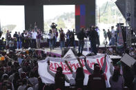 Delfina Gomez, left, MORENA political party gubernatorial candidate, greets supporters as she campaigns in Valle de Chalco, Mexico, Sunday, May 28, 2023. Voters in the state of Mexico go to the polls on June 4 to elect a new governor. (AP Photo/Marco Ugarte)