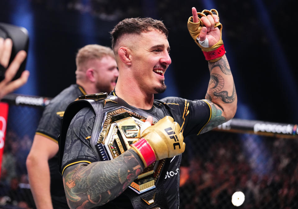 MANCHESTER, ENGLAND - JULY 27: Tom Aspinall of England reacts after his knockout victory against Curtis Blaydes in the interim UFC heavyweight championship bout during the UFC 304 event at Co-op Live on July 27, 2024 in Manchester, England. (Photo by Chris Unger/Zuffa LLC via Getty Images)