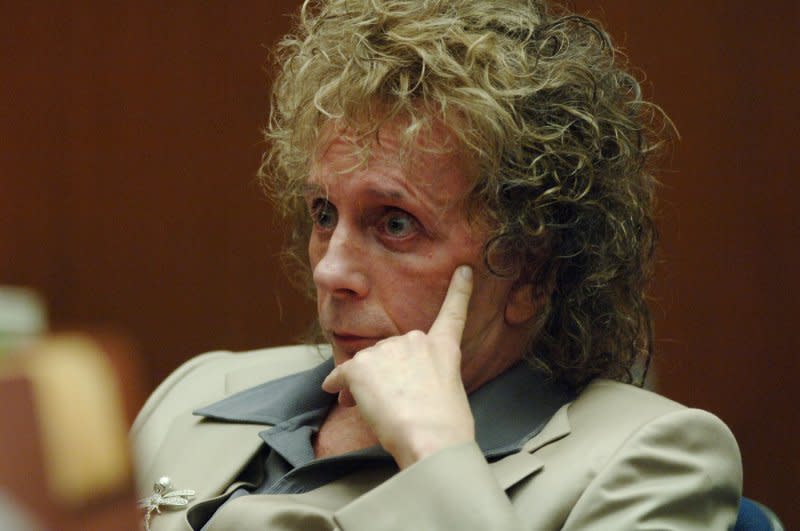Phil Spector listens to comments by the prosecutor as he appears for a pretrial hearing at the Los Angeles Superior Court in downtown Los Angeles October 27, 2005. On April 13, 2009, the music producer was found guilty of second-degree murder by a Los Angeles jury in his second trial for the 2003 slaying of Lana Clarkson, an actress and club hostess. He was sentenced to 19 years-to-life in prison. File Photo by Jim Ruymen/UPI