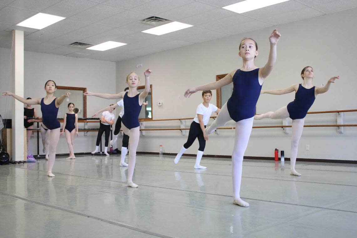 Emma Yeon, Greta Pilgreen, Samuel Stein, Alissa Brown and Rebecca Hiles participate in a ballet class at the Kansas City Ballet’s Prairie Village location.