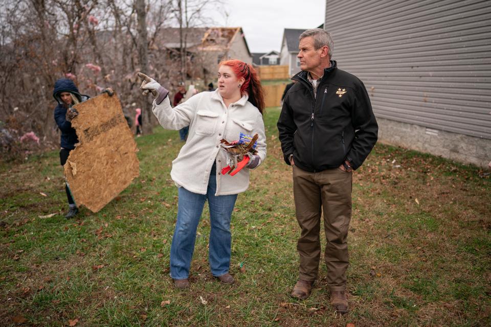 Gov. Bill Lee, right, speak with Kelsey Harris, left, who was helping clear debris in Clarksville, Tenn., Sunday, Dec. 10, 2023. Tornadoes struck Middle Tennessee on Saturday, killing at least six people and leaving more than 160,000 Middle Tennessee residents without power.