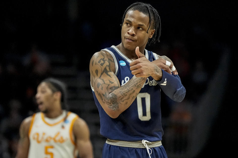 Saint Peter's guard Latrell Reid (0) reacts to play against Tennessee during the first half of a first-round college basketball game in the NCAA Tournament, Thursday, March 21, 2024, in Charlotte, N.C. (AP Photo/Mike Stewart)