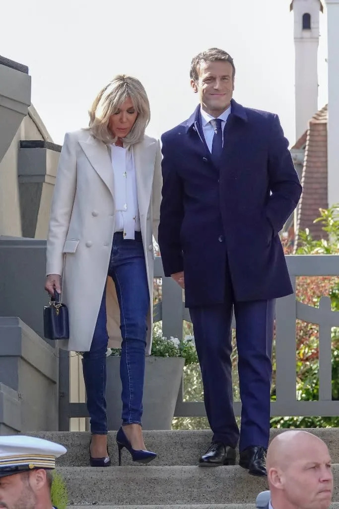 Brigitte Macron accompanies French President Emmanuel Macron to cast their ballot for the first round of France&#x002019;s presidential election at a polling station in Le Touquet, France on April 10, 2022. - Credit: Sipa USA via AP