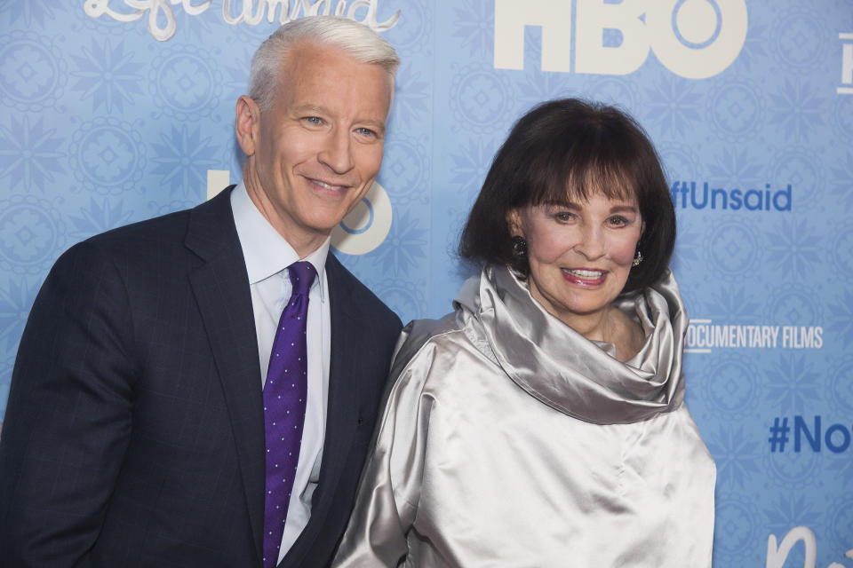 FILE - In this April 4, 2016 file photo, CNN anchor Anderson Cooper and Gloria Vanderbilt attend the premiere of "Nothing Left Unsaid" at the Time Warner Center in New York. Vanderbilt, the "poor little rich girl" heiress at the center of a scandalous custody battle of the 1930s and the designer jeans queen of the 1970s and '80s, died on Monday, June 17, 2019, at 95, according to her son, Cooper. (Photo by Charles Sykes/Invision/AP, File)