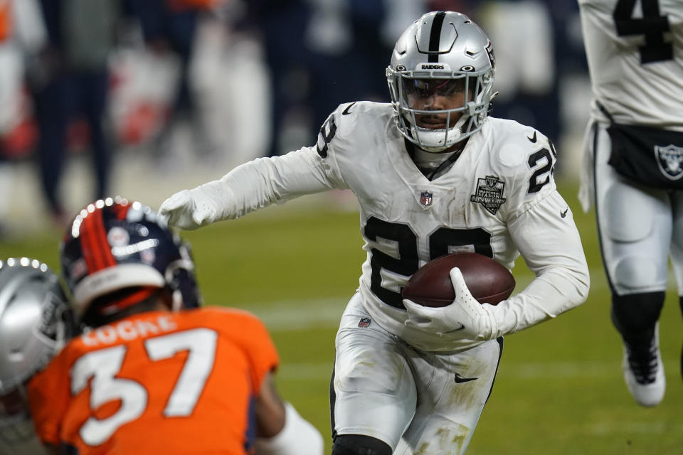 Las Vegas Raiders running back Josh Jacobs (28) runs for a touchdown against the Denver Broncos during the second half of an NFL football game, Sunday, Jan. 3, 2021, in Denver. (AP Photo/David Zalubowski)