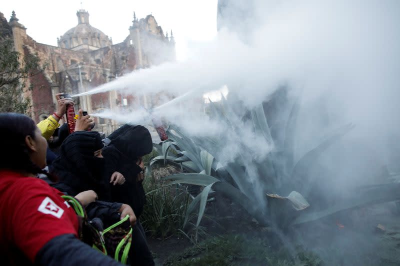 People take part in a protest against gender-based violence in downtown of Mexico City