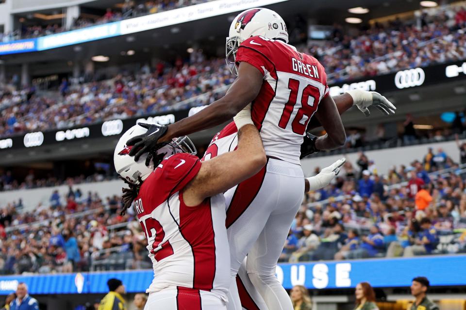 A.J. Green #18 of the Arizona Cardinals celebrates with Cody Ford #72 of the Arizona Cardinals after scoring a touchdown in the second quarter of the game against the Los Angeles Rams at SoFi Stadium on November 13, 2022, in Inglewood, California.