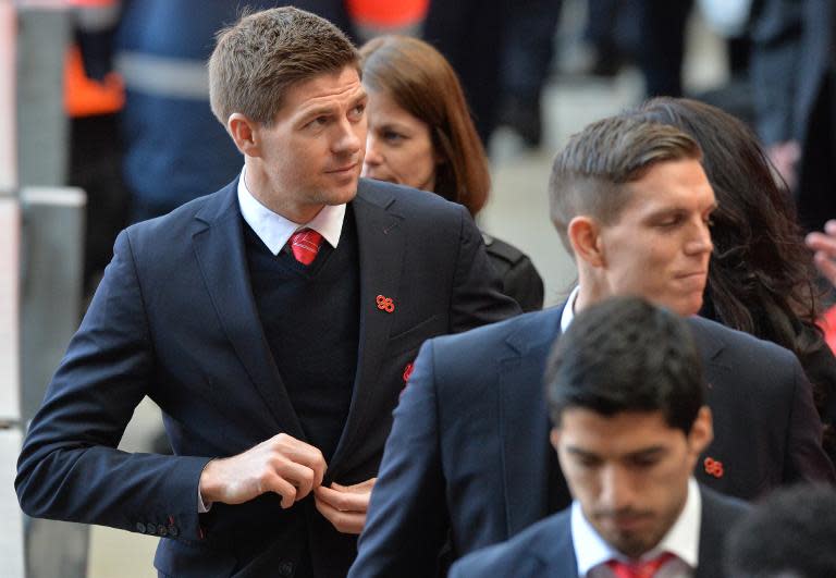 Liverpool football club captain Steven Gerrard (L) leaves after a memorial service to mark the 25th anniversary of the Hillsborough Disaster at Anfield Stadium in Liverpool, northwest England on April 15, 2014