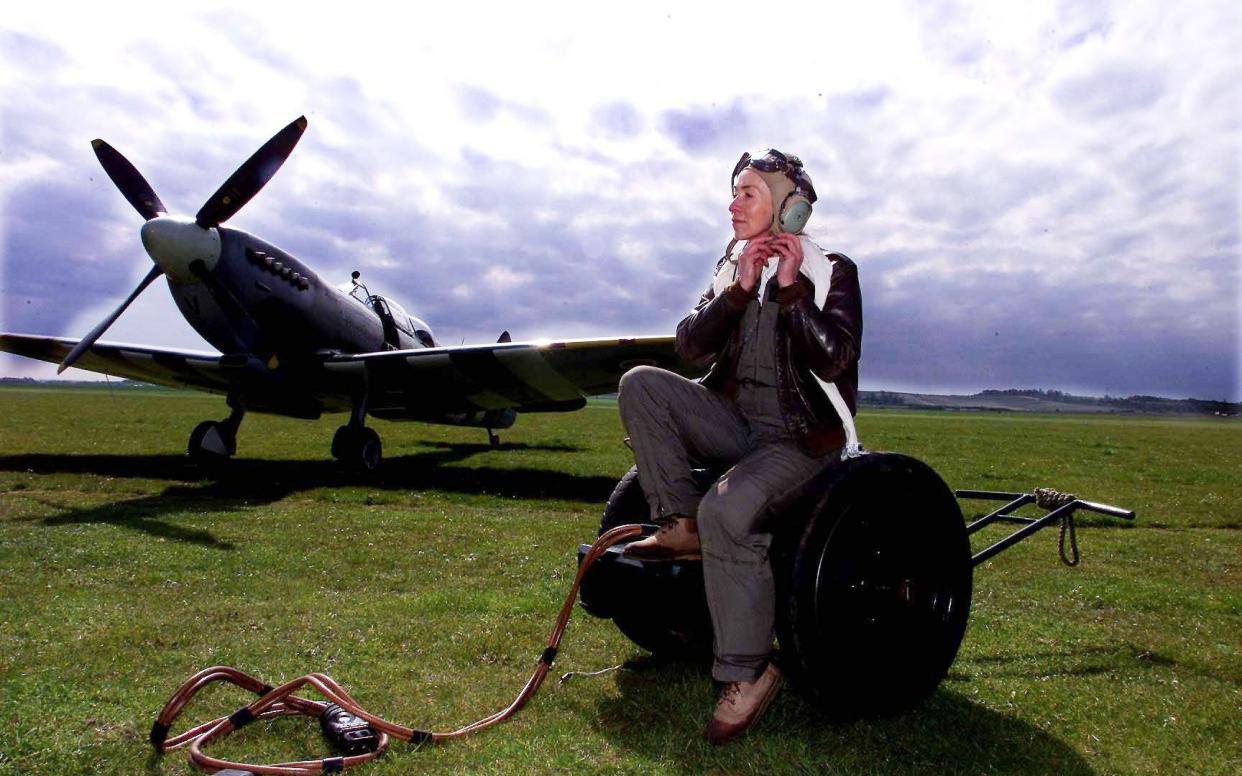 Carolyn Grace sits next to her aircraft in May 2001 ahead of flying in the Imperial War Museum's air show - Andrew Parsons