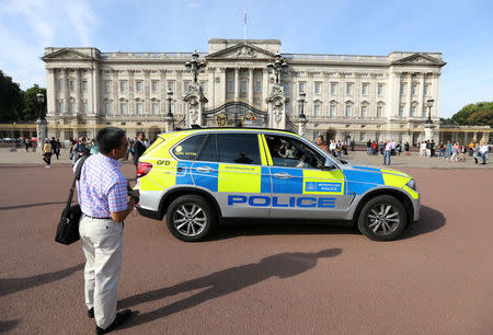 A police vehicle patrols outside Buckingham Palace in London, Britain August 26, 2017. REUTERS/Paul Hackett