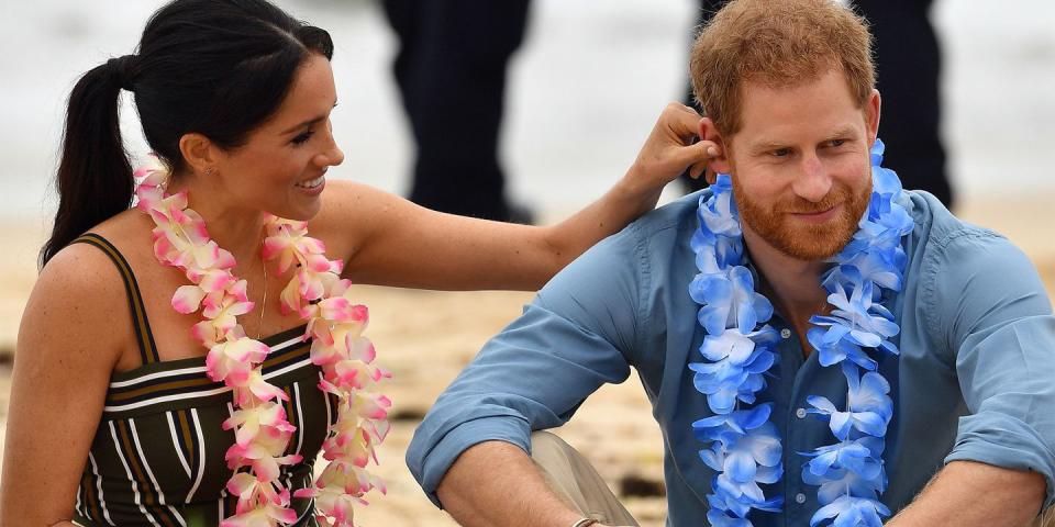 <p>Meghan touches Harry's ear as they enjoy <a rel="nofollow noopener" href="https://www.harpersbazaar.com/celebrity/latest/g23937359/meghan-markle-prince-harry-pda-royal-tour-bondi-beach/" target="_blank" data-ylk="slk:Bondi Beach;elm:context_link;itc:0;sec:content-canvas" class="link ">Bondi Beach</a>.</p>