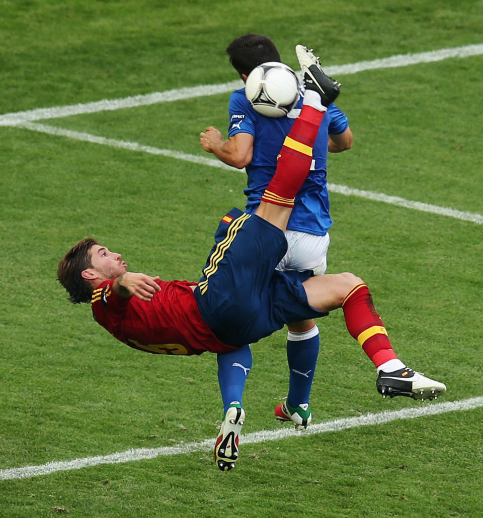 GDANSK, POLAND - JUNE 10: Sergio Ramos (front) of Spain tries to score with a bicycle-kick against Christian Maggio of Italy during the UEFA EURO 2012 group C match between Spain and Italy at The Municipal Stadium on June 10, 2012 in Gdansk, Poland. (Photo by Alex Grimm/Getty Images)