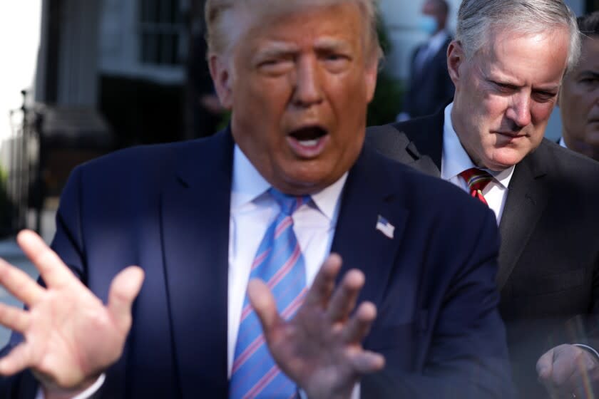 WASHINGTON, DC - JULY 29: U.S. President Donald Trump speaks as White House Chief of Staff Mark Meadows (R) listens prior to Trump's Marine One departure from the South Lawn of the White House July 29, 2020 in Washington, DC. President Trump is traveling to visit the Double Eagle Energy oil rig in Midland, Texas, and will attend a fundraising luncheon for the Republican Party and his reelection campaign. (Photo by Alex Wong/Getty Images)