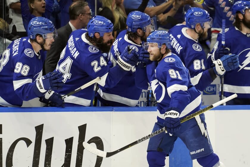 Tampa Bay Lightning center Steven Stamkos (91) celebrates with the bench after his goal.