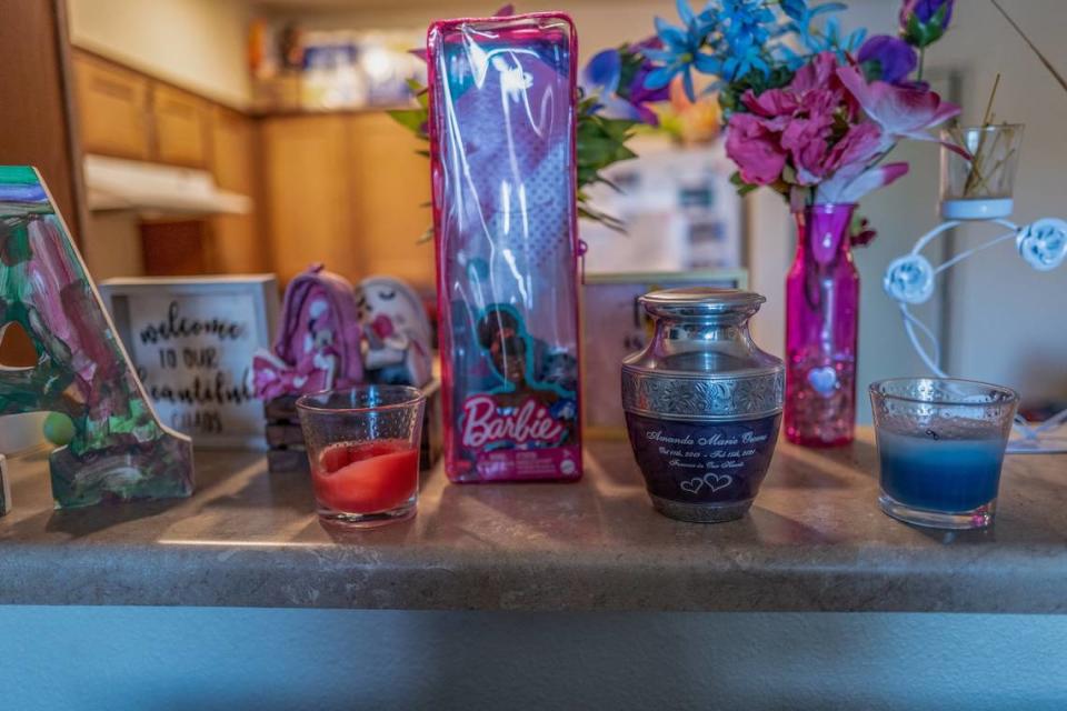 A memorial dedicated to Marquisha Brown’s daughter Amanda is displayed on the counter between her living room and her kitchen on April 5, 2023. Amanda died and her brother was brutally beaten in February 2021, allegedly by Brown’s former boyfriend Derrick Dimone Woods. He faces charges of first-degree murder, assault resulting in the death of a child under 8, and abuse or endangerment of a child under 5 with infliction of great bodily injury.