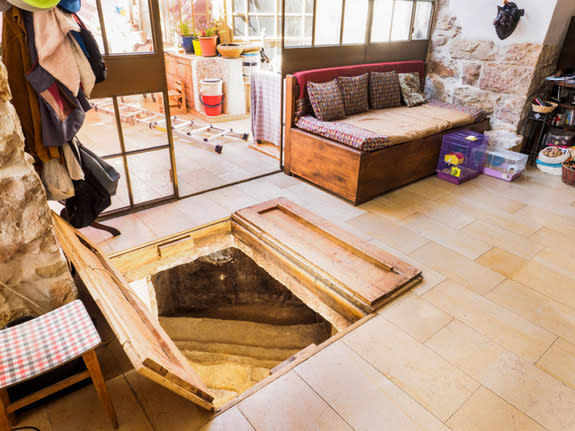 Stairs to an ancient ritual bath, or "miqwe," start in a homeowner's living room in Ein Karem.