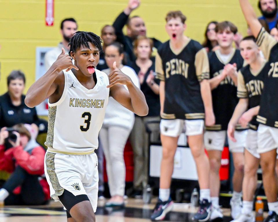 Penn's Markus Burton (3) celebrates after a three point basket to lead off the scoring against Marian Friday, Jan. 20, 2023, at Penn High School.

Hs Boys Basketball Marian At Penn