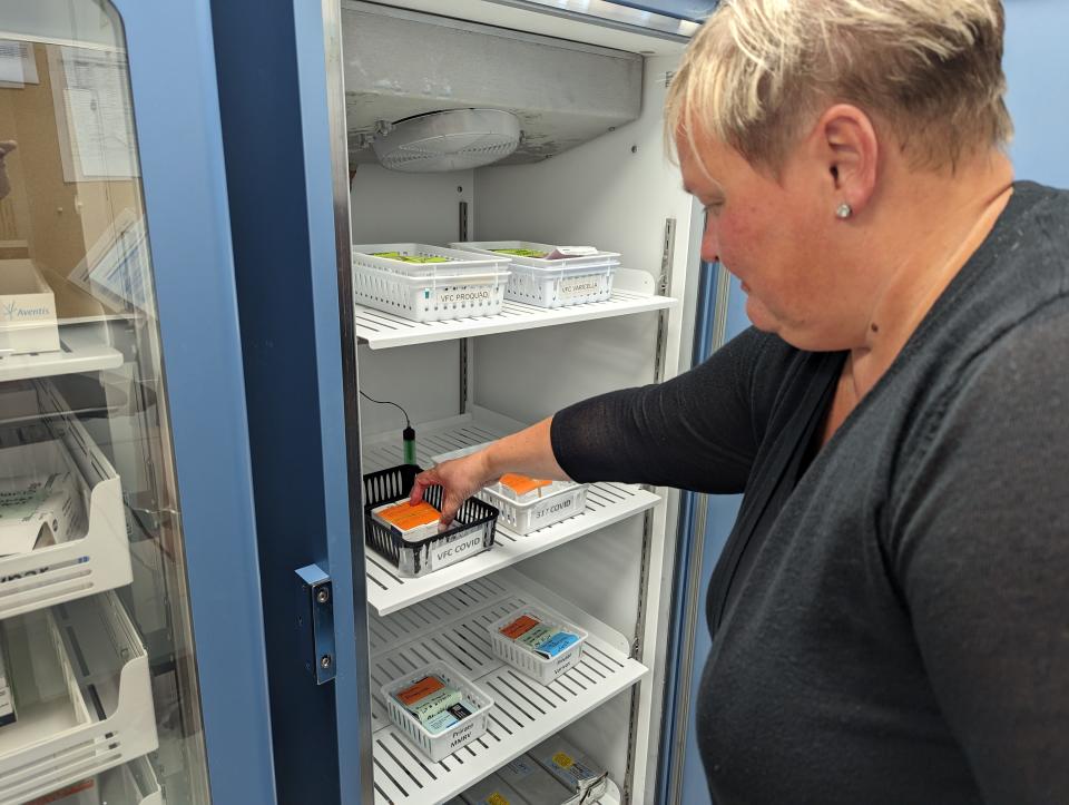 Beth Brown, director of the Sandusky County Public Health department, checks on vaccines in one of the refrigeration units.