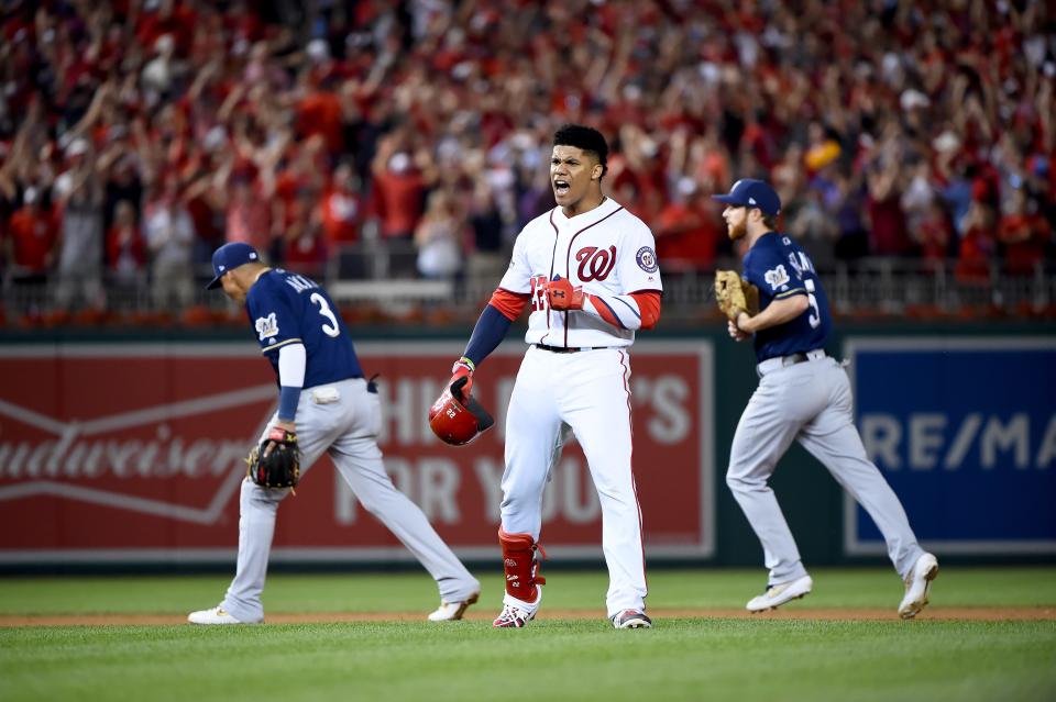 Juan Soto of the Washington Nationals celebrates after hitting a single to right field that scored 3 runs due to an error by Trent Grisham (not shown) of the Milwaukee Brewers during the eighth inning of the National League Wild Card game at Nationals Park on October 01, 2019 in Washington, DC.