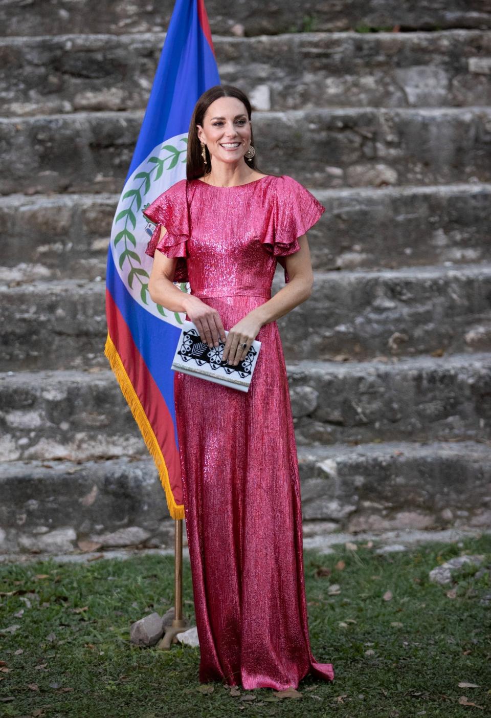 Kate smiling in a pink sequin dress.