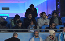 Former Argentinian footballer Diego Maradona (Top C) attends the English Premier League football match between Manchester City and Manchester United at The Etihad stadium in Manchester, north-west England on April 30, 2012. AFP PHOTO/ANDREW YATES RESTRICTED TO EDITORIAL USE. No use with unauthorized audio, video, data, fixture lists, club/league logos or “live” services. Online in-match use limited to 45 images, no video emulation. No use in betting, games or single club/league/player publications.ANDREW YATES/AFP/GettyImages