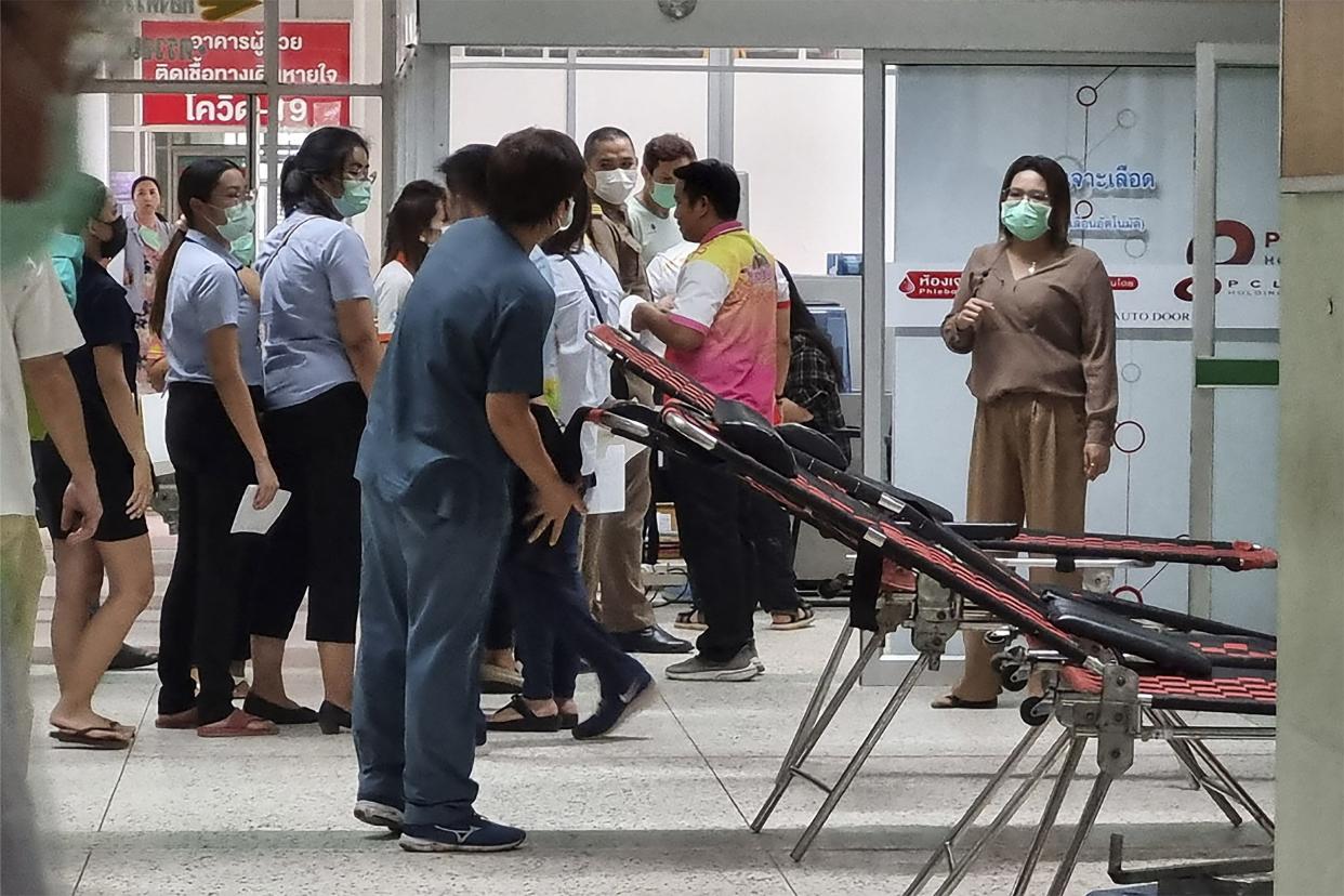 Residents line up to donate blood at the local hospital for victims of an attack at a daycare center, Thursday, Oct. 6, 2022, in the town of Nongbua Lamphu, northeastern Thailand.