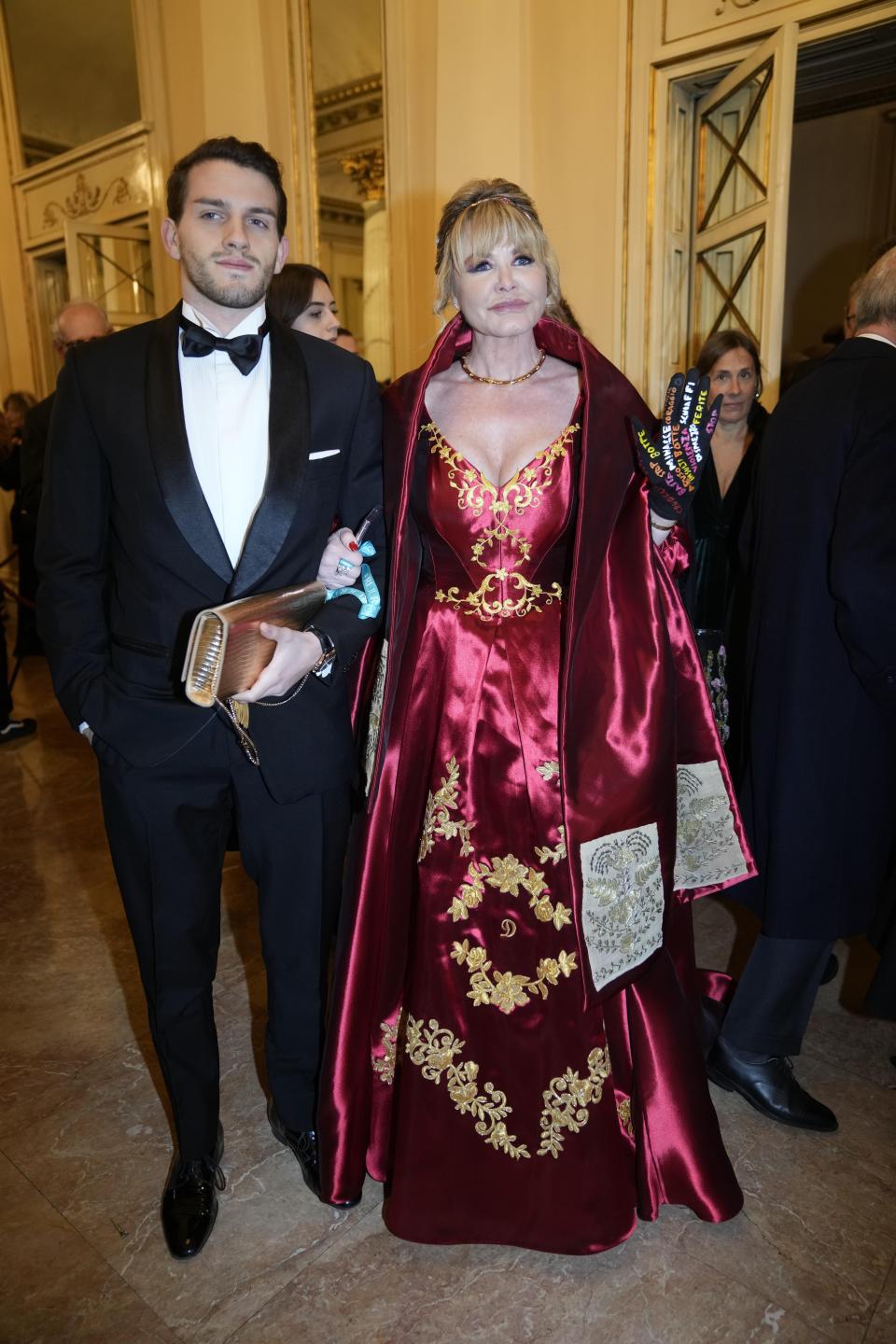 Doctor Dvora Ancona, right, arrives to attend La Scala opera house's gala season opener, Giuseppe Verdi's opera 'Don Carlo' at the Milan La Scala theater, Italy, Thursday Dec. 7, 2023. The season-opener Thursday, held each year on the Milan feast day St. Ambrose, is considered one of the highlights of the European cultural calendar. (AP Photo/Luca Bruno)