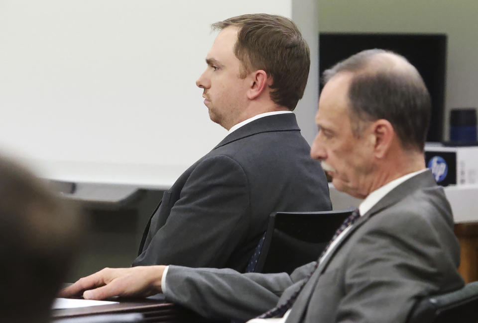 Aaron Dean listens as Ashley Carr, Atatiana Jefferson's sister, gives her victim impact statement on Tuesday, Dec. 20, 2022, at Tarrant County's 396th District Court at the Tim Curry Criminal Justice Center in Fort Worth, Texas. Former Fort Worth Police Officer Dean was sentenced to nearly 12 years after being convicted of manslaughter in the 2019 killing of Atatiana Jefferson. (Amanda McCoy/Star-Telegram via AP, Pool)