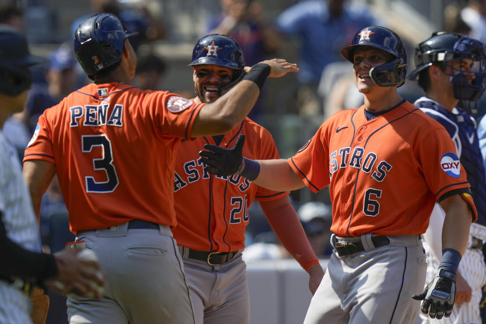 Houston Astros' Jake Meyers (6) is greeted by Jeremy Pena (3) and Chas McCormick (20) after hitting a three-run home run during the sixth inning of a baseball game against the New York Yankees at Yankee Stadium, Sunday, Aug. 6, 2023, in New York. (AP Photo/Seth Wenig)